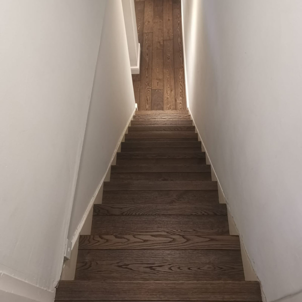 Clading Stairs in Dark Stained Oak planks